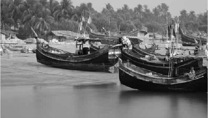 Fishing boats on a river shore